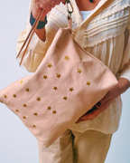 Leather bag with star embroidery.